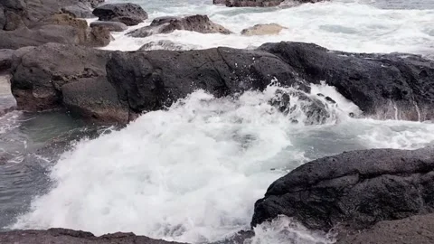 Small waves on the rocks Stock Footage 306076618