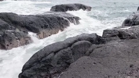 Small waves on the rocks Stock Footage 306077290