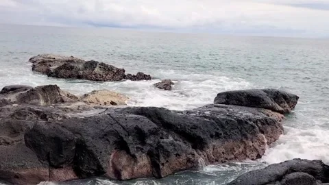 Small waves on the rocks Stock Footage 306077301