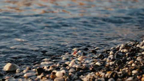 Small waves roll over rocks Stock Footage 147499291