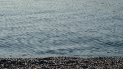 Small waves roll over rocks Stock Footage 147848499