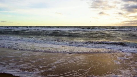 Small waves roll on the sand Stock Footage 82173665