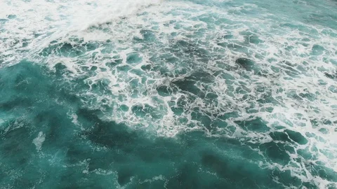 Small waves rolling near a volcanic beach on Tenerife, Canary Islands, aerial Vidéo 112032477