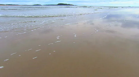 Small waves rolling right up to camera Stock Footage 538922