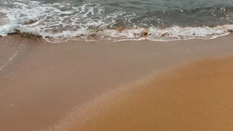 Small Waves Rolling, Washing, Crashing, onto Golden Yellow Beach Sand Shore Stock Footage 267804123