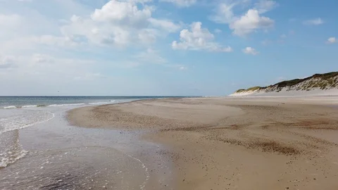 Small waves on the sand beach in summer Stock Footage 114422650