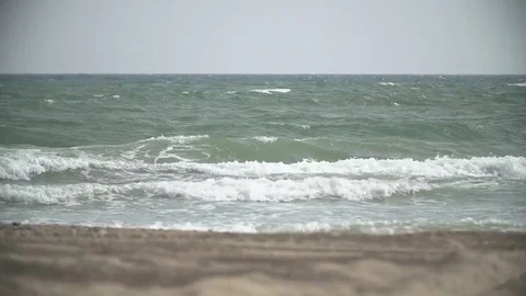 Small waves on the sandy beach Stock Footage 75175053