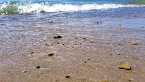 Small waves on a sandy beach. Stock Footage 76182048