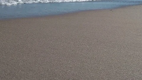 Small waves on sandy beach Stock Footage 82062157