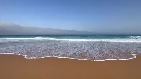 Small waves on sandy beach in golden hour. Summer holidays at the beach. Stock Footage 248818525