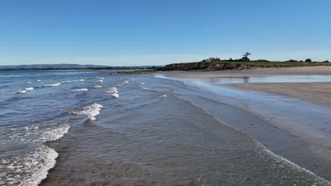 Small Waves on Sandy Beach Shoreline in 4K Stock Footage 332943512