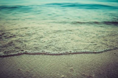 Small waves on sandy coast Foto stock