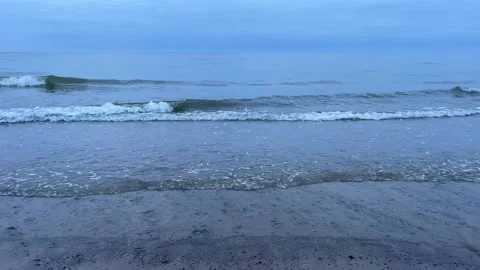 Small waves on the sandy shore of the Baltic Sea. Stock Footage 272213025