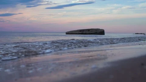 Small waves on the sea at sunset Stock Footage 196557647