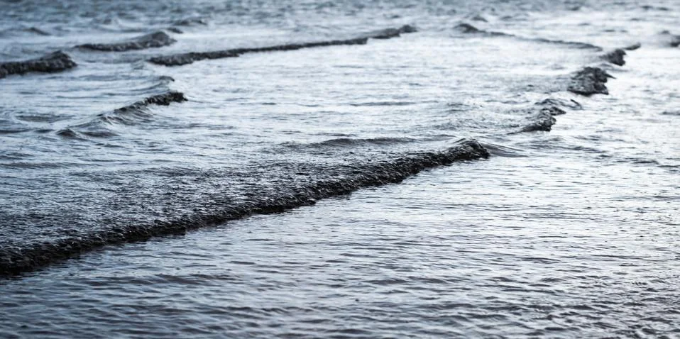 Small waves on the sea surfacev Stock Photos