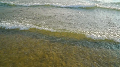 Small waves on the seashore. Slow motion Stock Footage 114065162