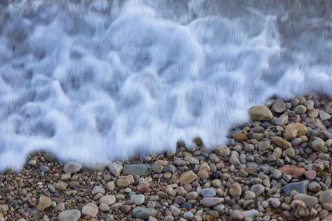 Small waves on the shore of the beach Stock Photos