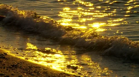 Small waves on shoreline at sunset Video stock 8667997