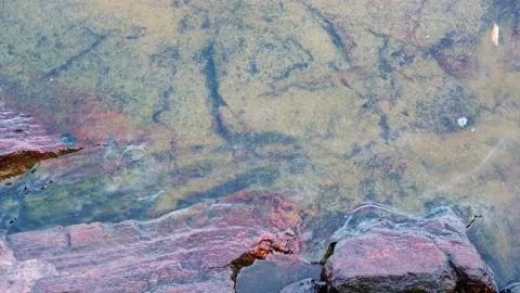 Small Waves on Smooth Rock Stock Footage 201621438