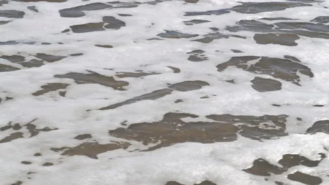Small waves splash at sandy beach in Cadiz, Andalusia, Spain Stock Footage 239002714