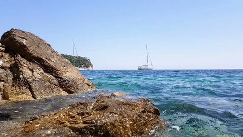 Small waves splashing on the rocks Stock Footage 92932801