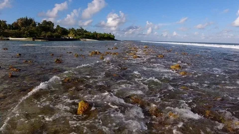 Small waves splashing on rocks Stock-Footage 94917873
