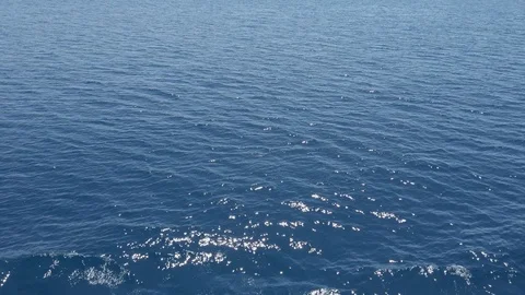 Small waves on the surface of a deep blue sea water on hot summer day clear b Stock Footage 124017584