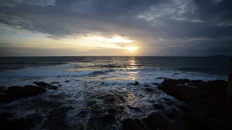 Small waves under a cloudy sky at sunset. Sardinia, Italy Stock Footage 126553511
