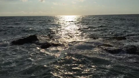 Small waves under the sunlight Stock Footage 130408903