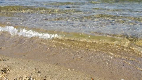 Small waves washing ashore Stock Footage 131708988
