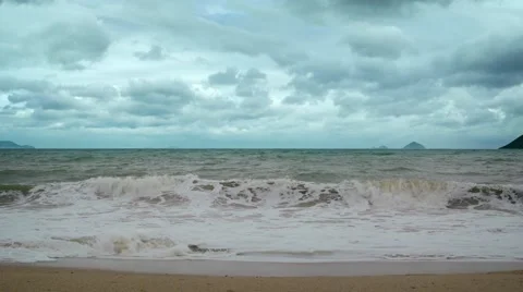 Small Waves Washing a Sandy Beach on a Cloudy Day. Footage UHD 스톡 동영상 64928892