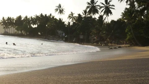 Small waves with white foam reaching on beach Stock Footage 71564073