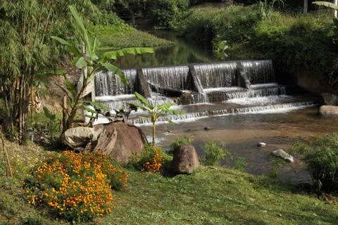 Small weir in valley Stock Photos