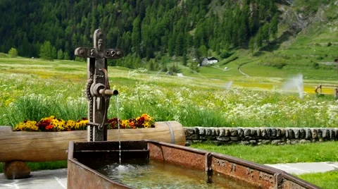 Small well in the Alps mountains Stock Footage 48727921