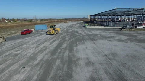 Small wheeled loader moving on construction site Video stock 64145539