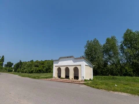 Small white building standing on the side of the road Stock Photos