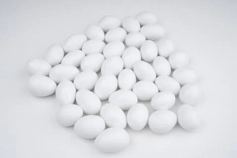 Small white candy on a white background Stock Photos