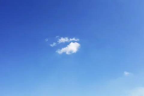 Small white cloud against blue sky, background Foto stock