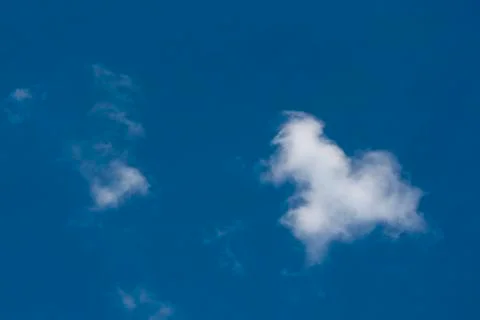 Small white clouds on blue sky Stock Photos
