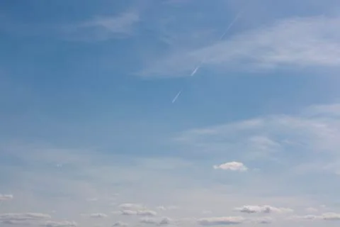 Small white clouds on blue sky Stock Photos