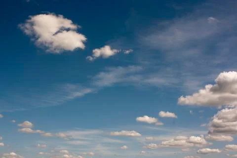 Small white clouds on blue sky Foto stock