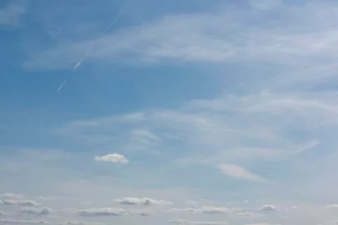 Small white clouds on blue sky Stock Photos