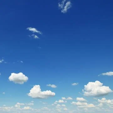 Small white clouds on sky background Stock Photos