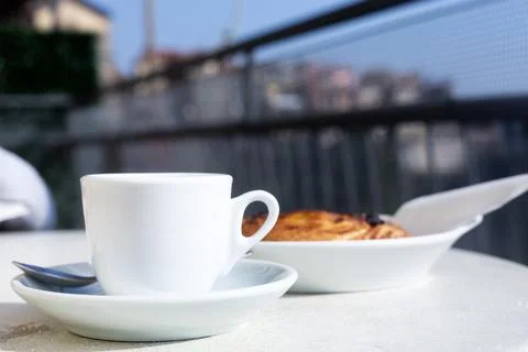 Small white empty cup espresso coffee in bright sunlight. Meditation moment Stock Photos