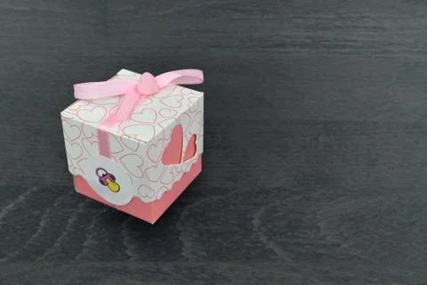 Small white gift boxes with pink hearts and ribbon with pink bow Stock Photos