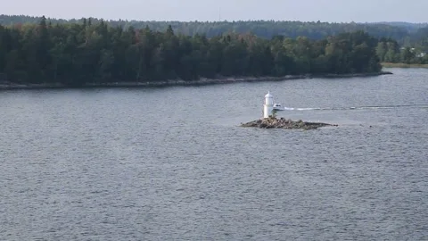 Small white lighthouse at the Baltic sea Stock Footage 182458551