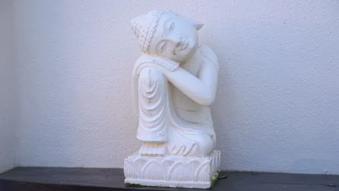 Small White Marble Buddha in Asian Garden Stock Footage 272748069