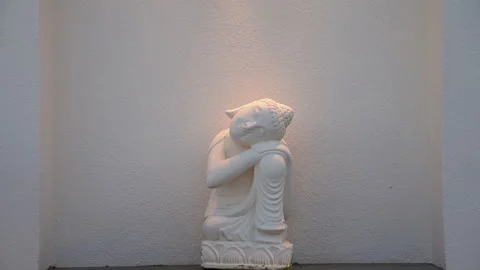 Small White Marble Buddha in Asian Garden Stock Footage 275006979