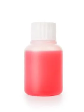 Small white plastic bottle with red liquid isolated with clipping path Stock-Fotos