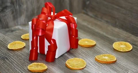 Small white present with red ribbon Stock Photos